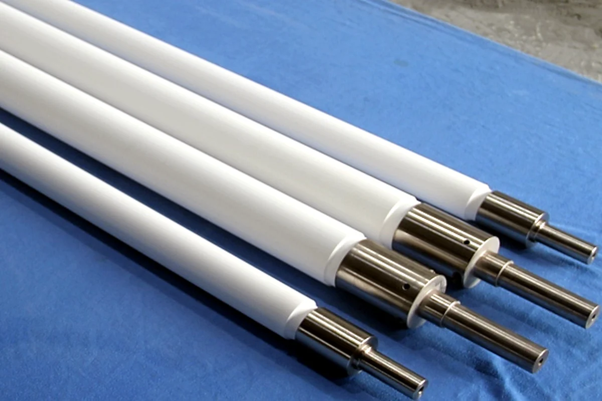 Fused silica ceramic rollers with machined metal end fittings